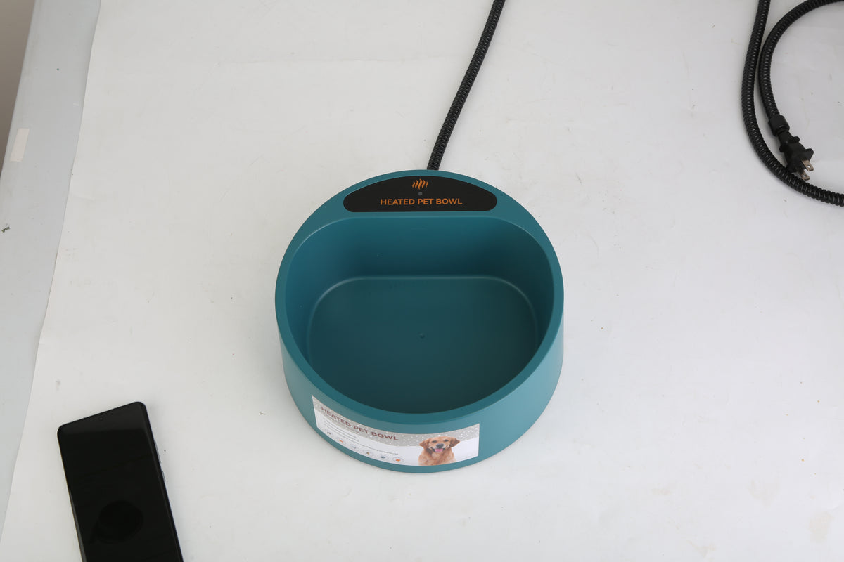 Chew-resistant cord and anti-slip foam pads on heated pet bowl